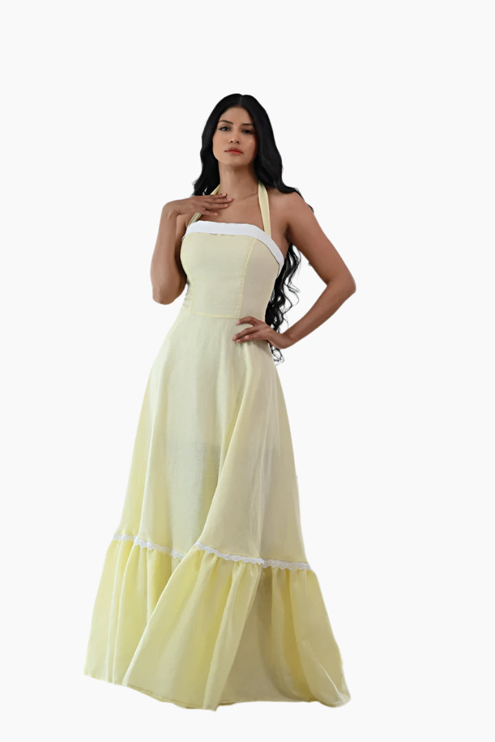 Woman wearing a light yellow halter neck dress 