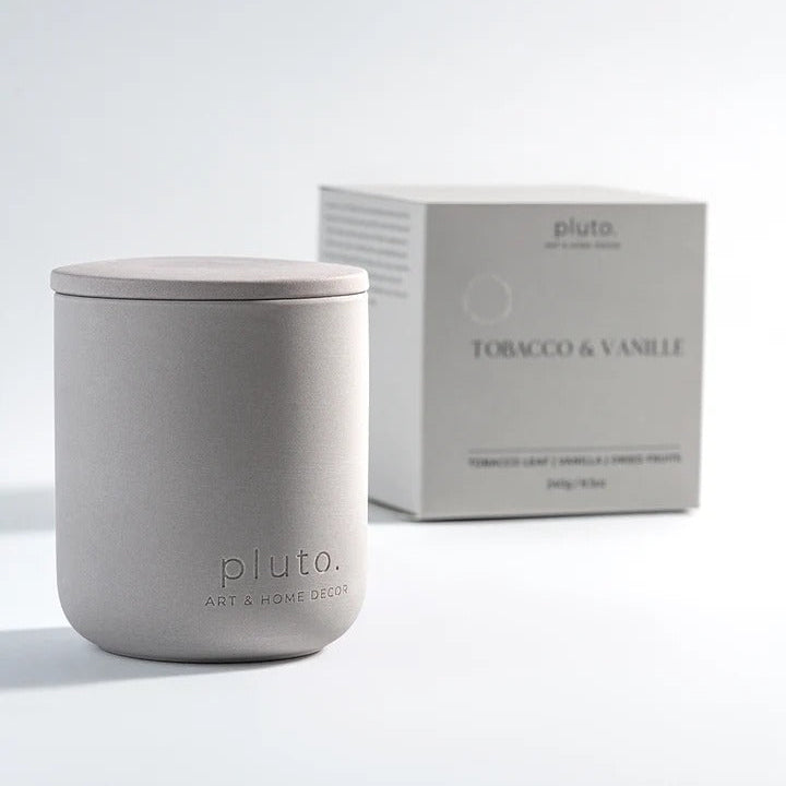 Gray candle with lid and 'pluto' branding]