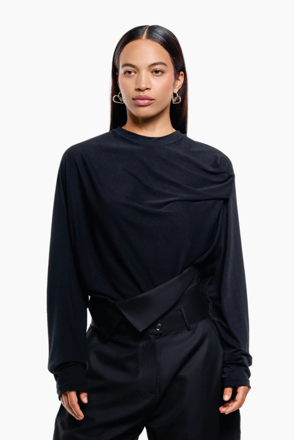 Person wearing a black outfit black top and pants 