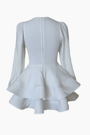 White dress with ruffled end