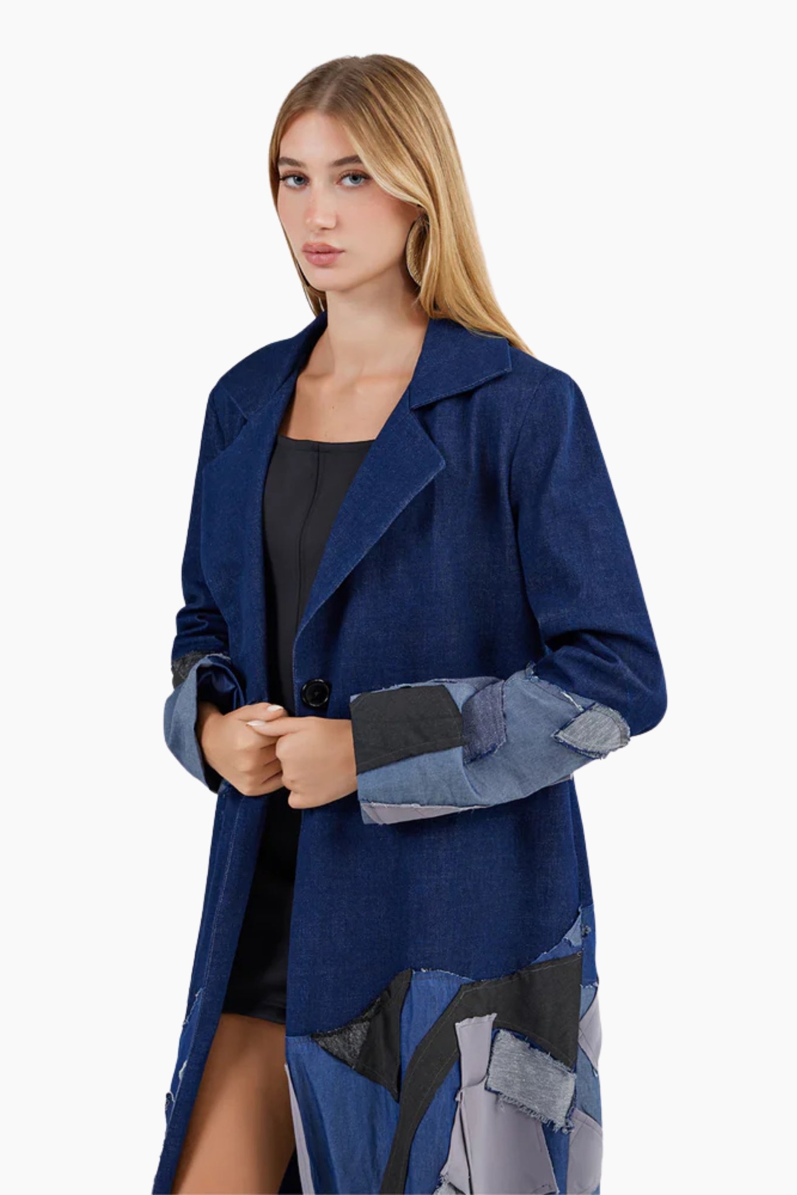 Woman wearing a blue coat with patchwork design 