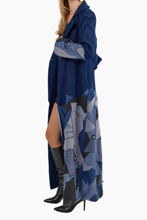 Long blue patterned coat worn by a person 