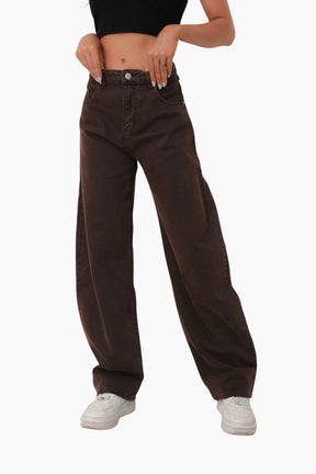 Person wearing brown wide-leg jeans 