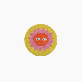 The Loteria El Sol coaster is handmade in India from beautiful, colorful beads. 