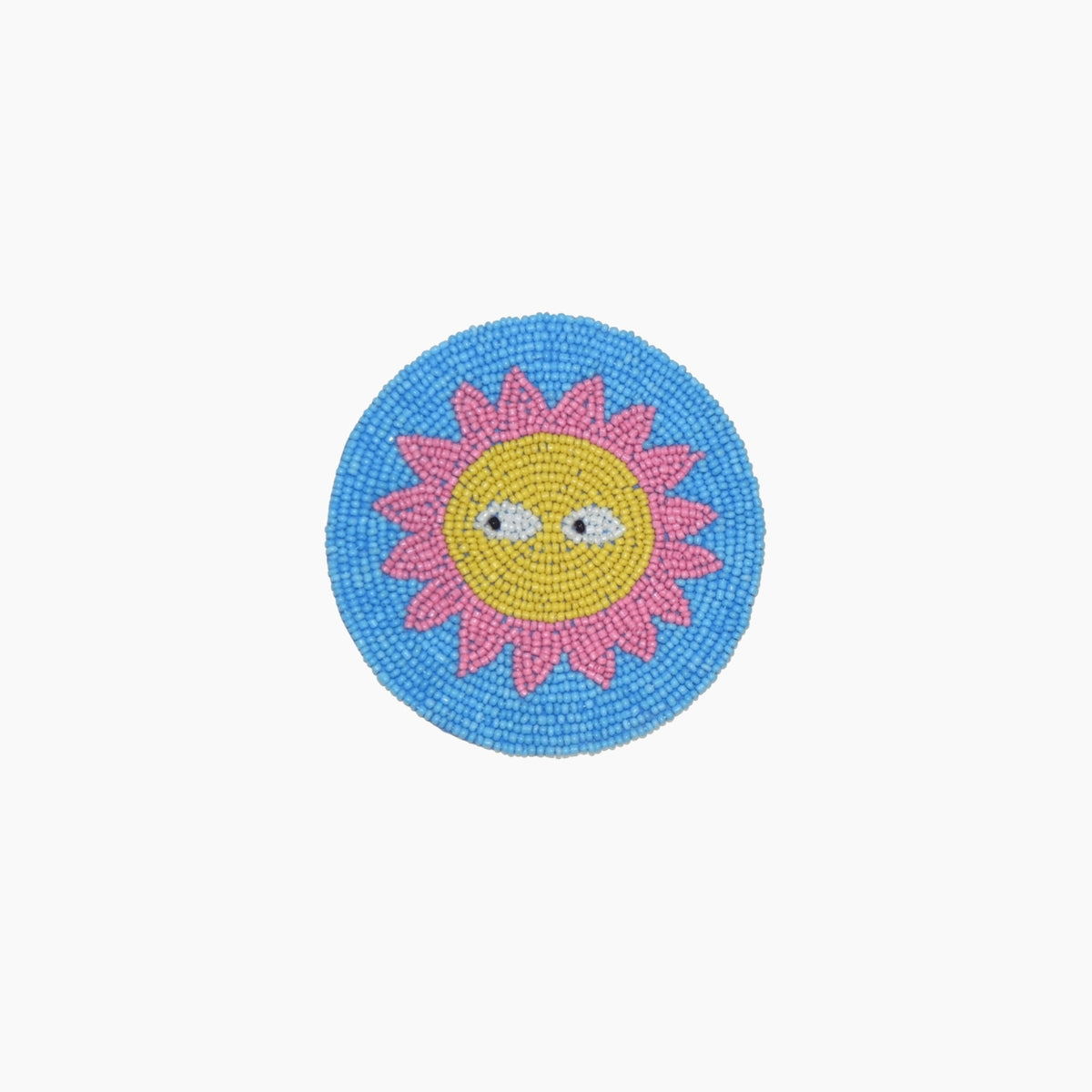 Circular beaded coaster with a sun design 