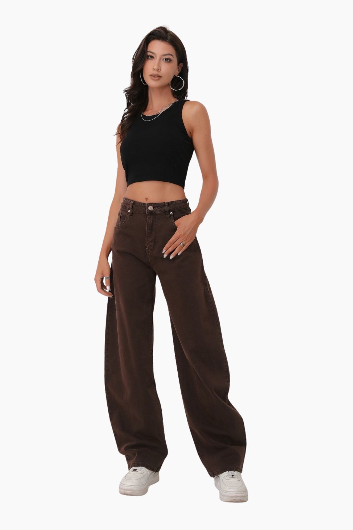 Woman wearing a black crop top and brown wide-leg pants 