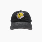 Black cap with smiley face design 