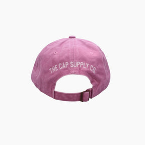 Pink cap with 'The Cap Supply Co.' logo 