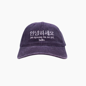 Purple cap with white text 