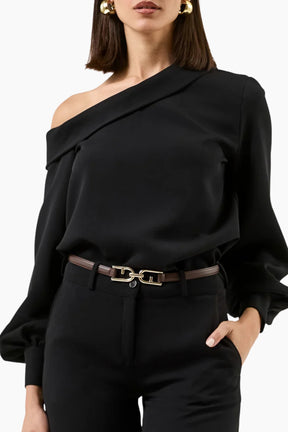 Black off-shoulder top with a belt worn by a person 