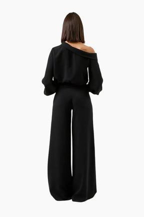 Black off-shoulder top and wide-leg pants 