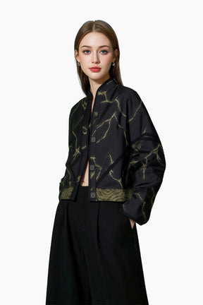 Woman wearing a Dark green patterned bomber jacket