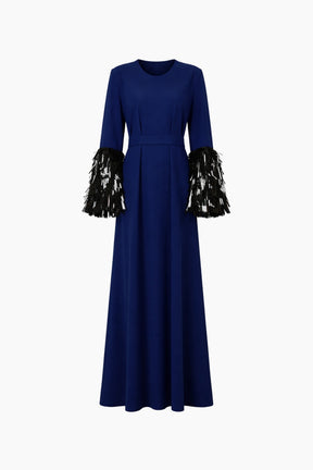 Long blue dress with black and gold embellished sleeves on a white background