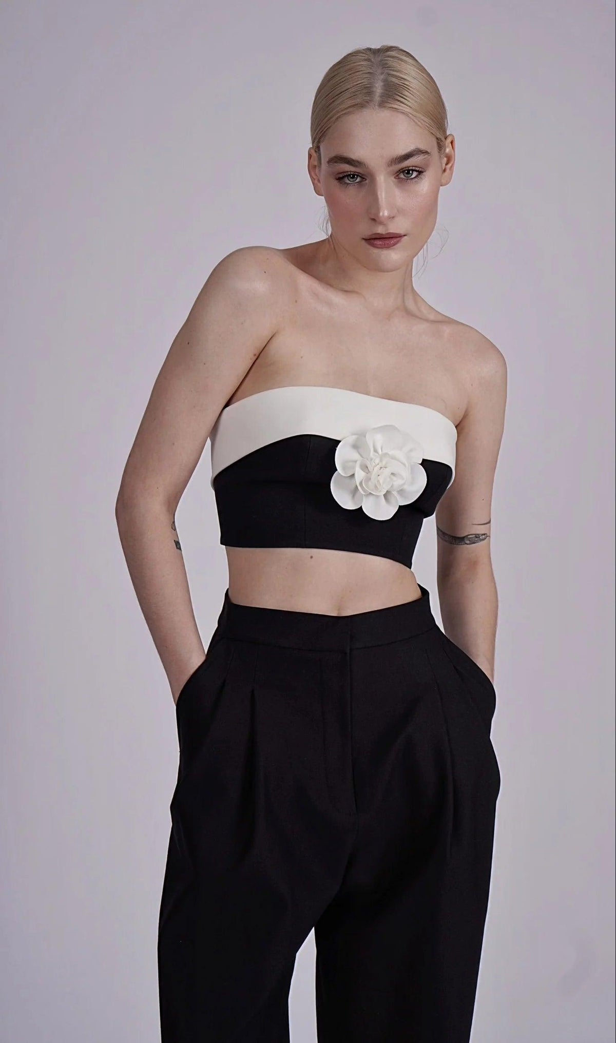 OFF-SHOULDER: JASPER BLACK & WHITE STRIPE TOP WITH FLOWER - FLTRD UAE