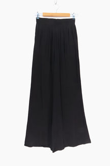 Black skirt on a hanger against 