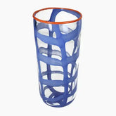 Blue glass tumbler with orange rim 