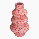 Pink textured vase with red dots 