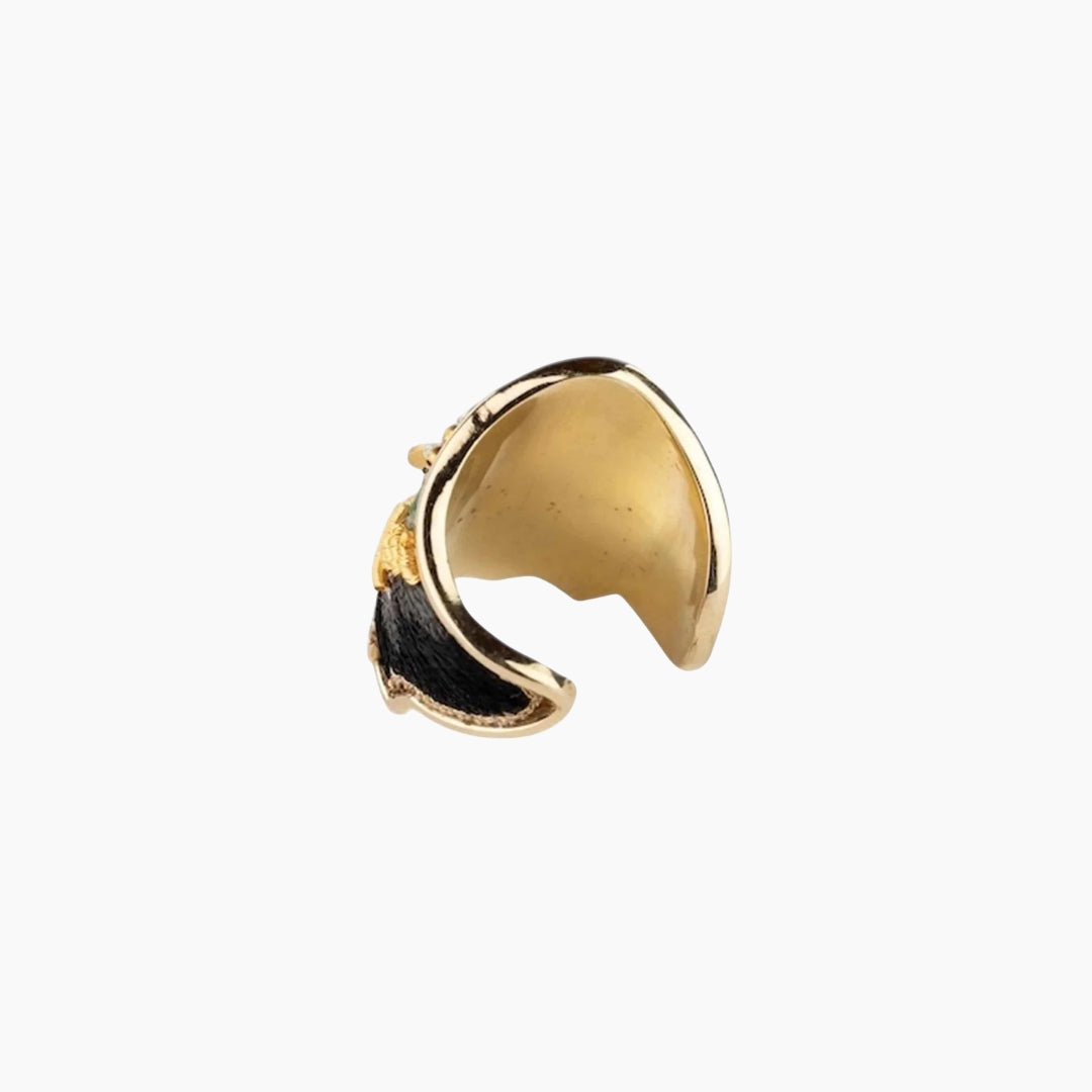 Gold ring with black accents 
