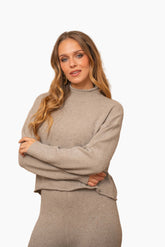 Woman wearing a beige knit outfit
