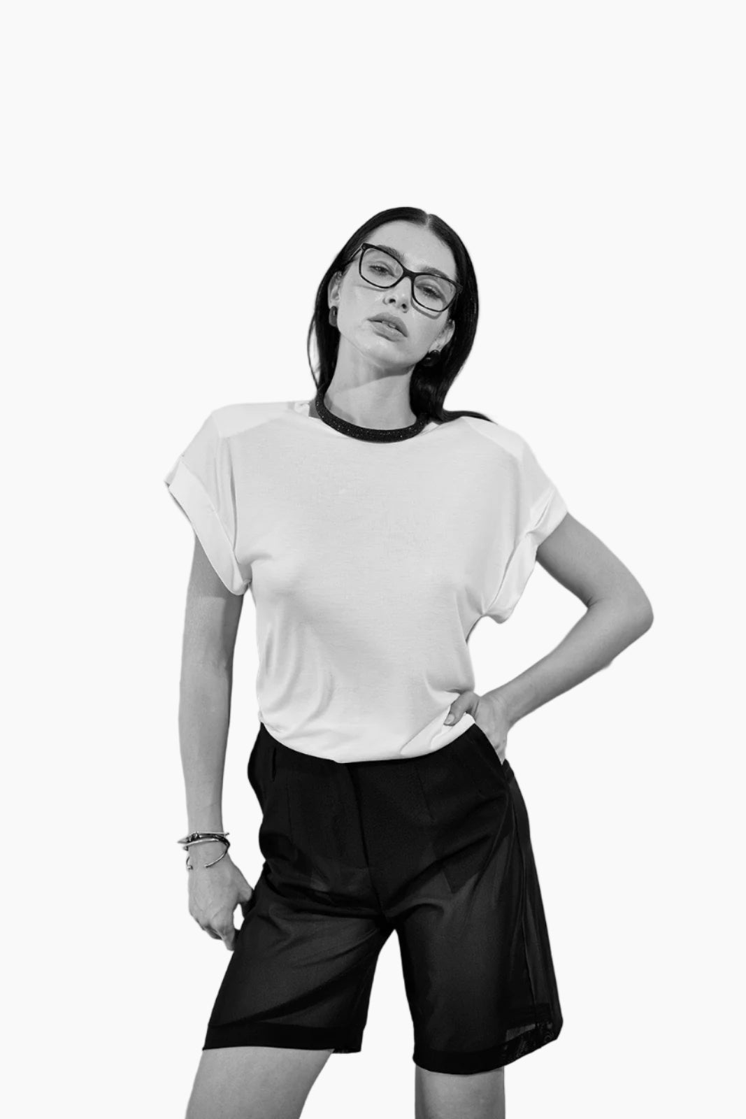 Person wearing a white t-shirt and black shorts 