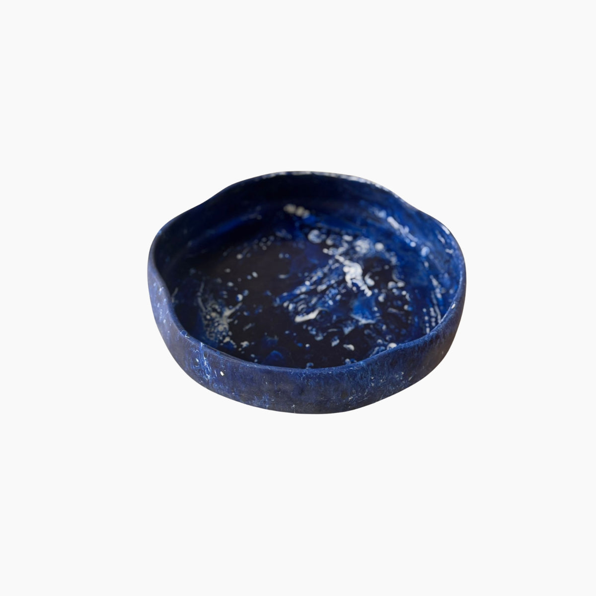 Blue ceramic bowl on a white background