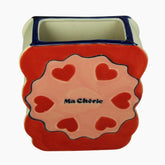 Ceramic planter with heart design and 'Ma Chérie' text 